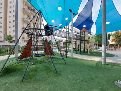 Psagot Playgrounds Colorado Springs - hexagonal tower with tunnel and slides