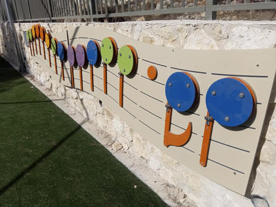 Psagot Playgrounds Music Wall - wall-mounted chime instrument with musical staff layout