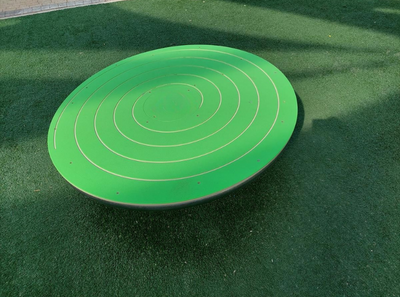 Psagot Playgrounds Tornado - group of children playing on spinning plate
