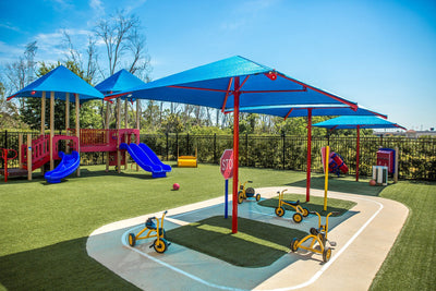 Superior Shade single-post square umbrella shade over a play area