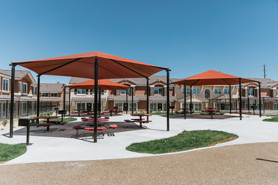 Superior Shade hexagon hip end fabric shade over a seating area