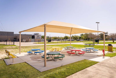 Superior Shade rectangle hip end fabric shade over an outdoor classroom