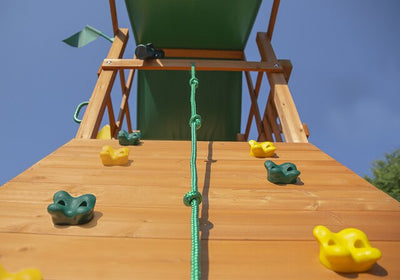 Gorilla-Playsets-Outing-W-Trapeze-Bar-Wooden-Swing-Set-Rock-Wall-Close-Up